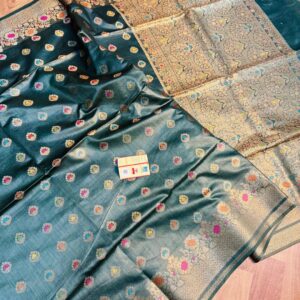 Vibrant bottle green pure Bhagalpuri Munga silk saree from Bhavya Lakshmi Fabrics featuring multi-color floral butis and an intricate gold zari border
