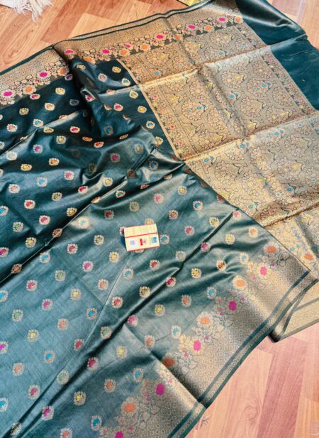 Vibrant bottle green pure Bhagalpuri Munga silk saree from Bhavya Lakshmi Fabrics featuring multi-color floral butis and an intricate gold zari border