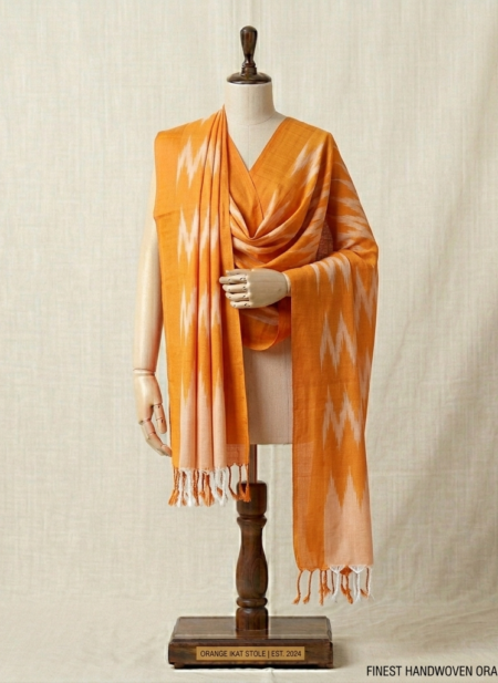 Bhavya Lakshmi Fabrics orange and white handwoven Ikkat cotton dupatta on a mannequin.