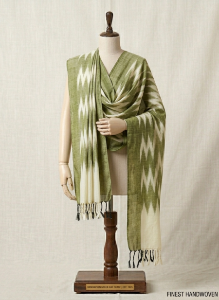 Bhavya Lakshmi Fabrics olive green and cream handwoven Ikkat cotton dupatta on a mannequin.