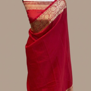 Scarlet red Banarasi Katan silk saree with a plain body and a broad traditional gold zari floral border