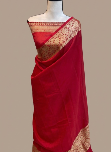 Scarlet red Banarasi Katan silk saree with a plain body and a broad traditional gold zari floral border