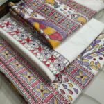 Off-white dupion slub silk unstitched suit material featuring traditional purple, yellow, and red Madhubani fish and tree prints.