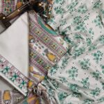Off-white dupion slub silk unstitched suit material featuring traditional yellow fish motifs and geometric Madhubani art prints.