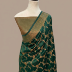 Bottle green Banarasi Katan silk saree with an all-over gold zari floral jaal pattern and a decorative zari border