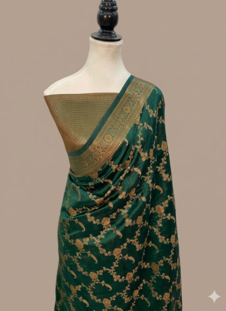 Bottle green Banarasi Katan silk saree with an all-over gold zari floral jaal pattern and a decorative zari border