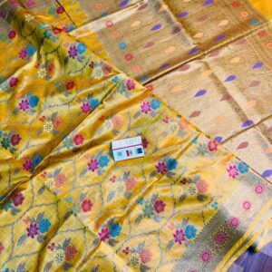 Vibrant golden yellow pure Bhagalpuri Munga silk saree from Bhavya Lakshmi Fabrics featuring a multi-color floral Meenakari jaal and an intricate gold zari border