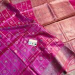 Vibrant Rani pink pure Bhagalpuri Munga silk saree from Bhavya Lakshmi Fabrics featuring gold zari checks with multi-color floral Meenakari butis and an intricate gold zari border