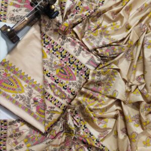 A premium unstitched beige Katan silk suit material set by Bhavya Lakshmi Fabrics featuring detailed multicolored Madhubani art hand-painted style prints on the top, bottom, and dupatta.