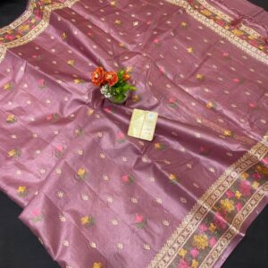 A luxurious mauve lavender pure Bhagalpuri Munga silk handloom saree from Bhavya Lakshmi Fabrics featuring detailed multicolored floral embroidery scattered butis and an ornate floral border.