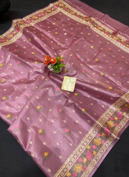 A luxurious mauve lavender pure Bhagalpuri Munga silk handloom saree from Bhavya Lakshmi Fabrics featuring detailed multicolored floral embroidery scattered butis and an ornate floral border.