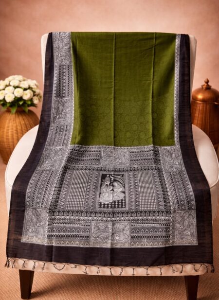 A deep mehendi green Kota silk Bhagalpuri saree from Bhavya Lakshmi Fabrics featuring detailed black and white monochrome Madhubani art prints of divine couples and peacocks