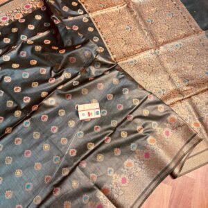 Sophisticated midnight black pure Bhagalpuri Munga silk saree from Bhavya Lakshmi Fabrics featuring multi-color floral butis and an intricate gold zari border