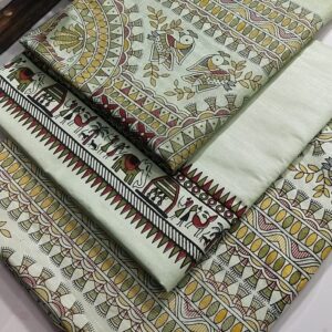 An unstitched mint green Katan silk suit material set by Bhavya Lakshmi Fabrics featuring detailed handwoven style Madhubani prints of birds, elephants, and ritual huts in mustard yellow and red.
