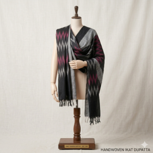 Handwoven Pochampally Ikkat cotton dupatta in black, grey, and magenta geometric patterns on a mannequin.