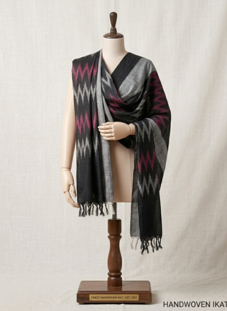 Handwoven Pochampally Ikkat cotton dupatta in black, grey, and magenta geometric patterns on a mannequin.