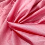 Regal rose pink pure Tussar Munga silk fabric with a rich, textured weave for premium menswear.