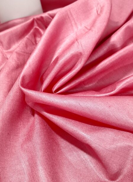 Regal rose pink pure Tussar Munga silk fabric with a rich, textured weave for premium menswear.
