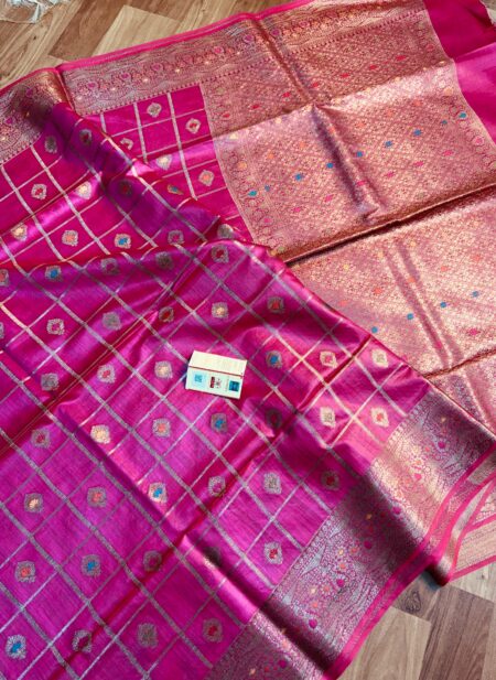 Vibrant Rani pink pure Bhagalpuri Munga silk saree from Bhavya Lakshmi Fabrics featuring gold zari checks with multi-color floral Meenakari butis and an intricate gold zari border