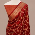 Crimson red Banarasi Katan silk saree with an all-over gold zari floral jaal pattern and a decorative zari border