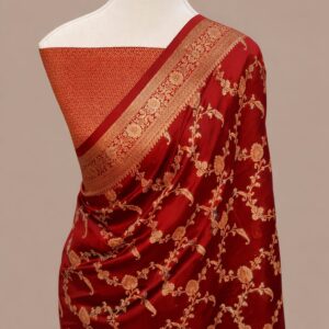 Crimson red Banarasi Katan silk saree with an all-over gold zari floral jaal pattern and a decorative zari border