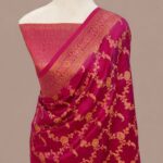 Magenta pink Banarasi Katan silk saree with an all-over gold zari floral jaal pattern and a decorative zari border