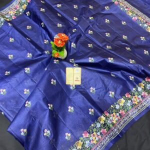 A royal navy blue pure Bhagalpuri Munga silk handloom saree from Bhavya Lakshmi Fabrics featuring detailed multicolored floral embroidery scattered butis and an ornate floral border.