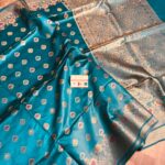 Vibrant sea green pure Bhagalpuri Munga silk saree from Bhavya Lakshmi Fabrics featuring multi-color floral butis and an intricate gold zari border