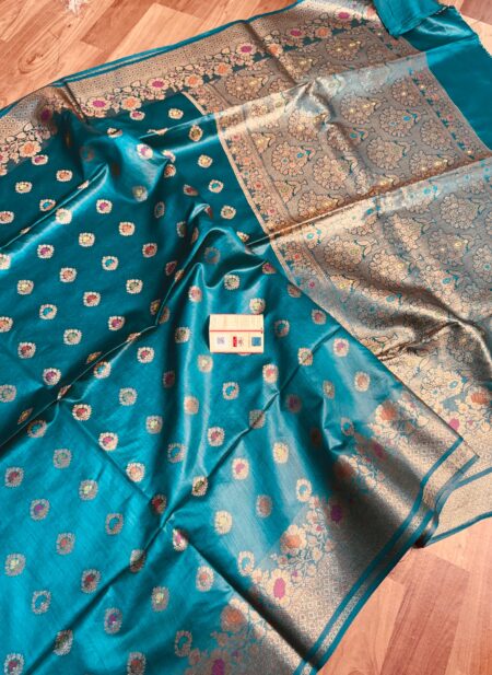 Vibrant sea green pure Bhagalpuri Munga silk saree from Bhavya Lakshmi Fabrics featuring multi-color floral butis and an intricate gold zari border