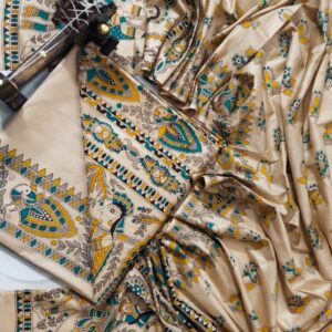 An unstitched cream Katan silk suit material set by Bhavya Lakshmi Fabrics featuring detailed multi-colored Madhubani prints of royal elephants, peacocks, and human figures in teal blue and mustard yellow.