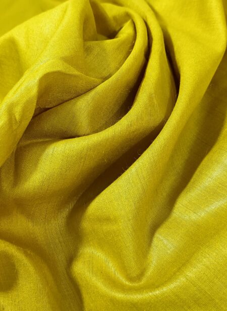Vibrant golden yellow Tussar Munga pure silk fabric with a rich texture, ideal for premium men's ethnic wear.