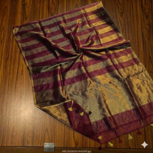 Rich maroon and metallic gold zari striped tissue silk saree featuring intricate borders and matching tassel details.