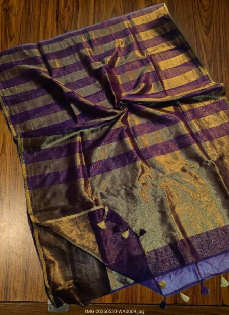 Royal purple and metallic gold zari striped tissue silk saree featuring intricate borders and matching tassel details.