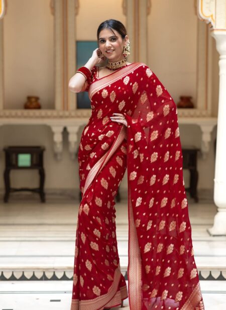 Vibrant bridal red semi organza saree featuring woven golden zari floral buttas and a matching patterned blouse.
