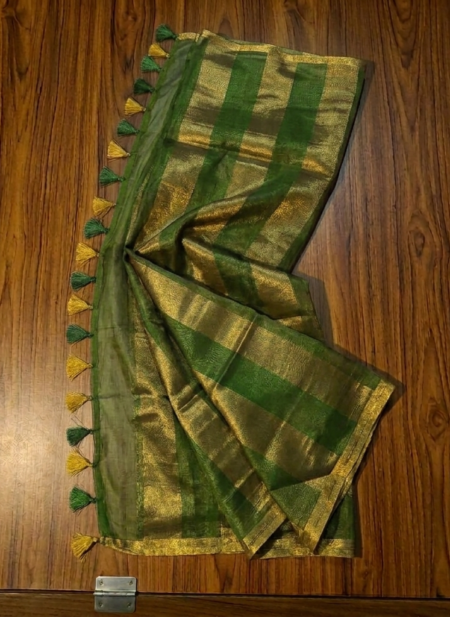 Sophisticated olive green and metallic gold zari striped tissue silk saree featuring intricate borders and matching tassel details.