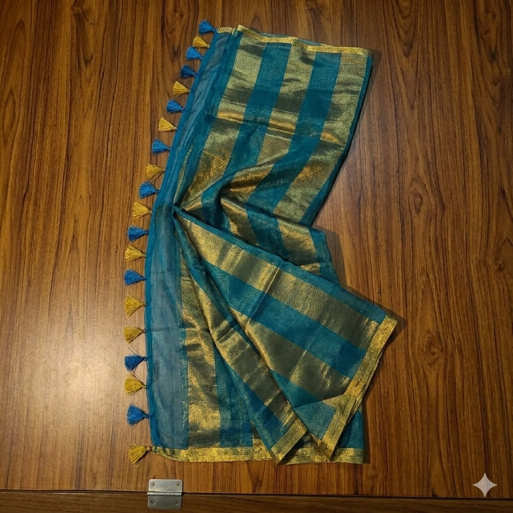 Tissue Silk Saree Teal Blue & Gold Zari Stripes Bhavyaloom Sophisticated teal blue and metallic gold zari striped tissue silk saree featuring intricate borders and matching tassel details.