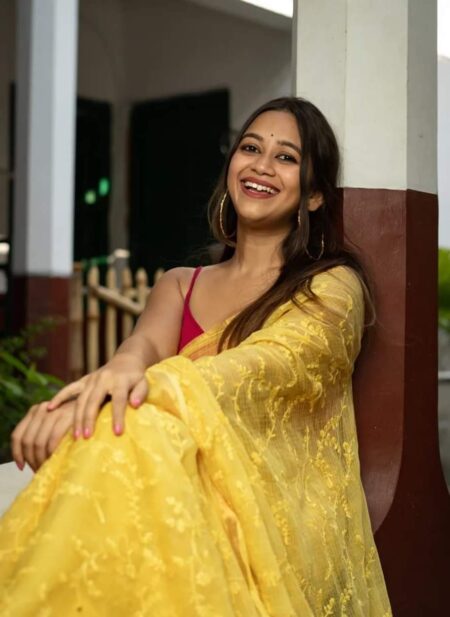 Bhavyaloom sunshine yellow bhagalpuri kota doria embroidery saree with pink border details draped on smiling model