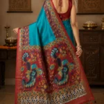 Bhavyaloom turquoise blue premium kota viscose saree with maroon kalamkari border and peacock motif pallu front view