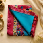 Bhavyaloom turquoise blue premium kota viscose saree with maroon kalamkari border and peacock motif pallu front view